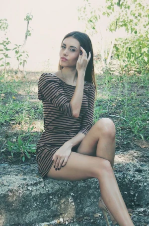 Leggy fuckdoll bimbo posing on a spot outdoors