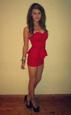 Beautiful doll dressed in a sexy red dress