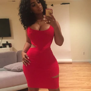 Ebony in tight red dress