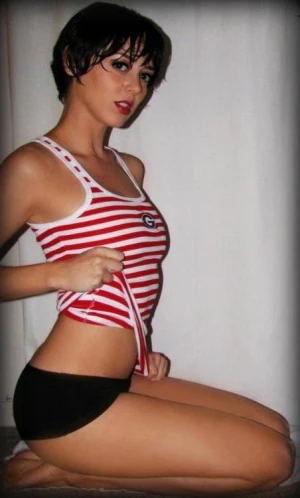 Short-haired brunette is trying to be sexy