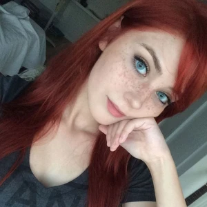 Redhead, freckles, green eyes