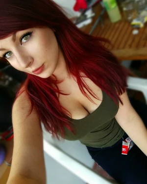 Redhead showing big tits