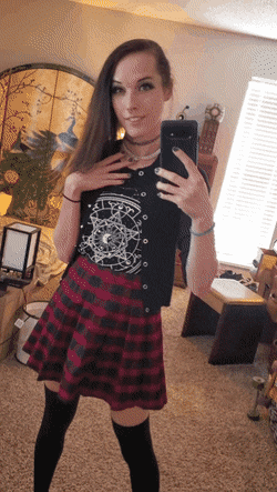 Smiling above her skirt and below