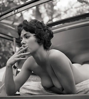 First she sucks on a cig, then on a cock.