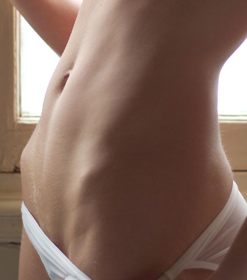 Hip Bones And Fit Tummy In White Underwear