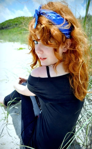 redhead black shirt blue bandana