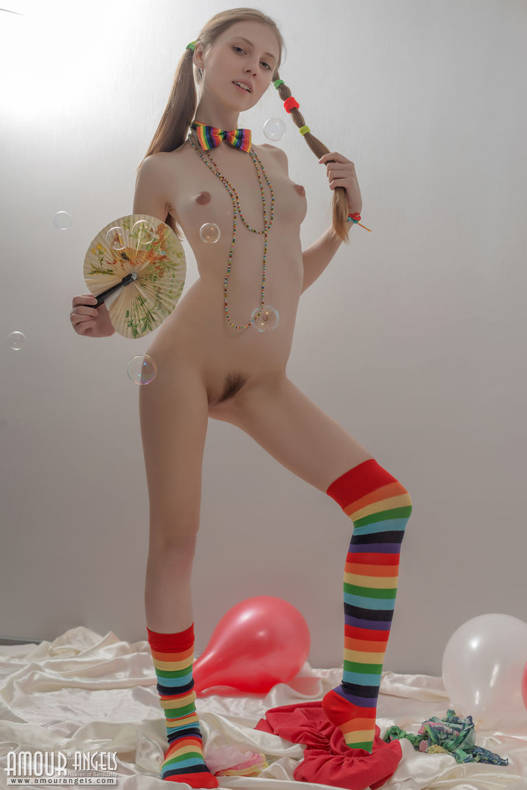 Skinny blonde in pigtails