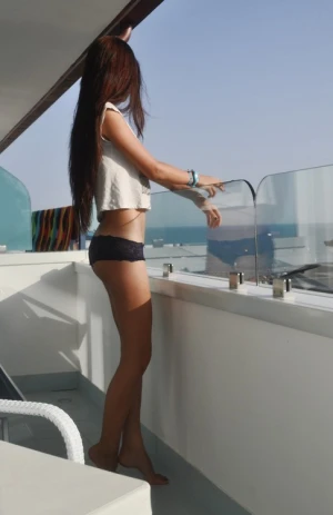 Brunette teen with long legs in boy shorts