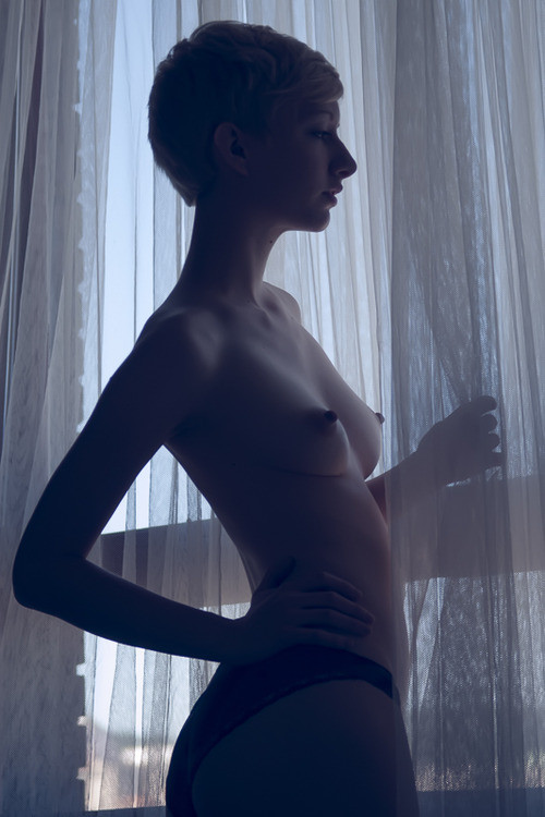 Petite short haired, sexy and naked inside her home
